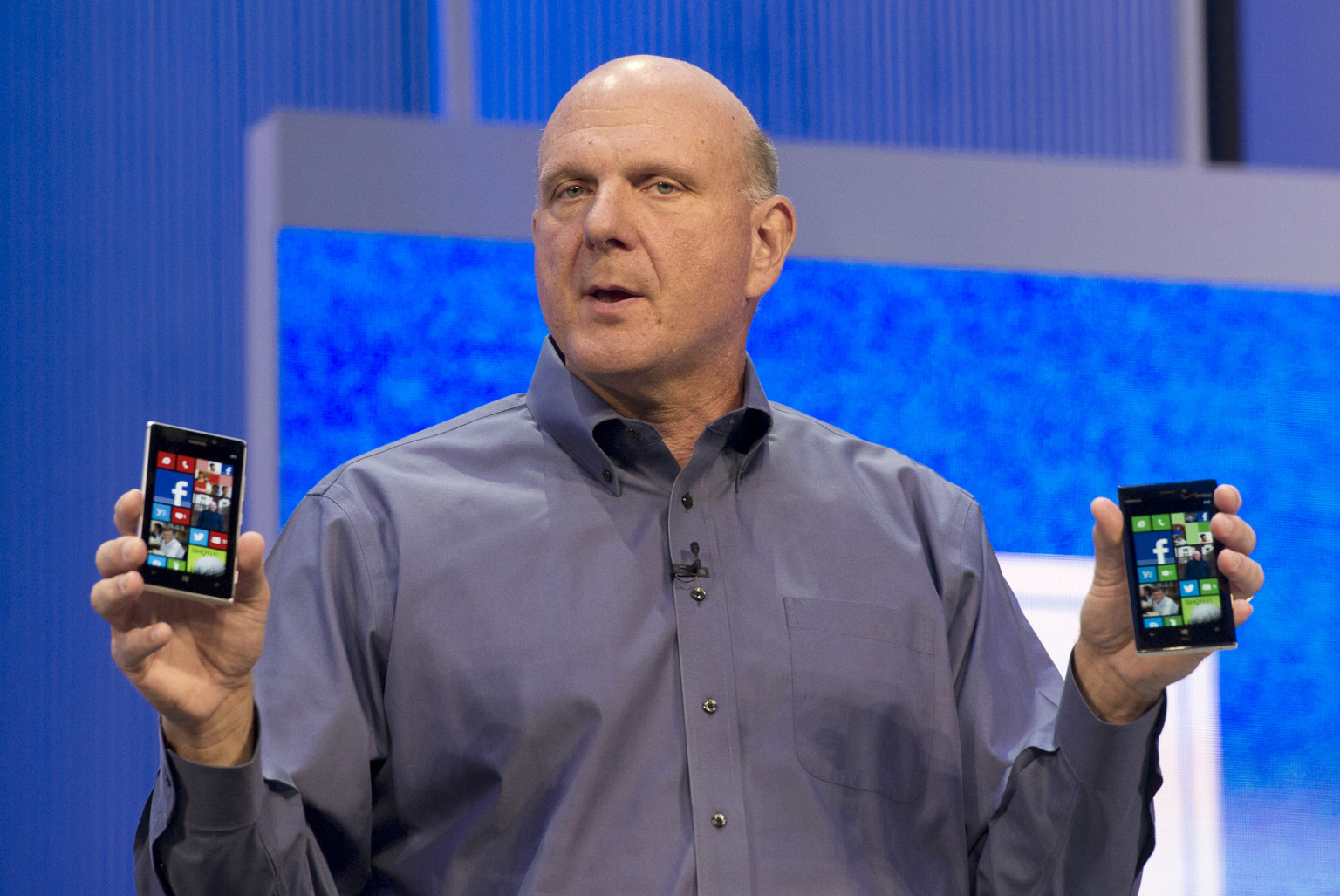 Steve Ballmer, chief executive officer of Microsoft Corp., holds up Nokia OYJ smart phones while delivering the keynote during the Microsoft Build Developers Conference in San Francisco, California, U.S., on Wednesday, June 26, 2013. Facebook Inc. is building an application for Microsoft Corp.'s Windows 8, adding one of the most popular programs still missing from the operating system designed to help Microsoft gain tablet customers. Photographer: David Paul Morris/Bloomberg via Getty Images